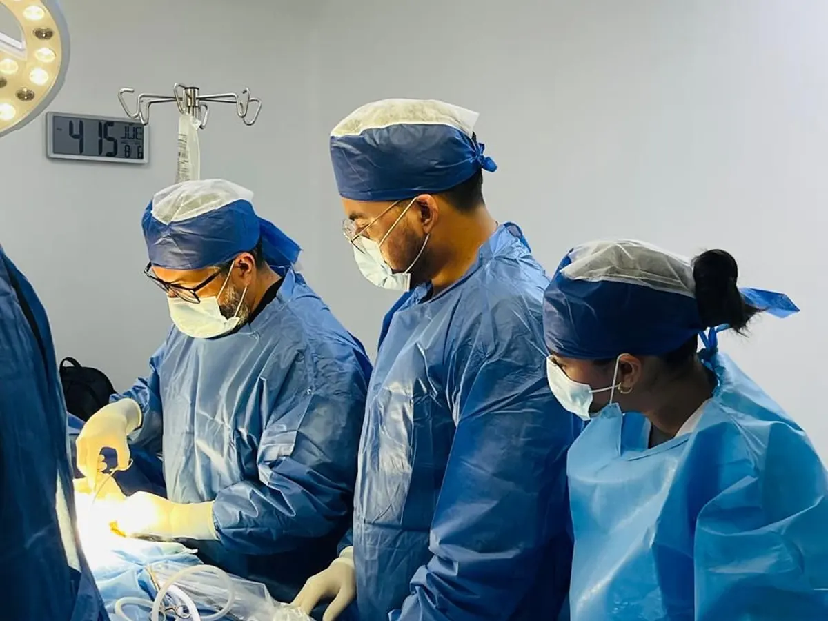 Surgeons operating together in an operating room in Tijuana